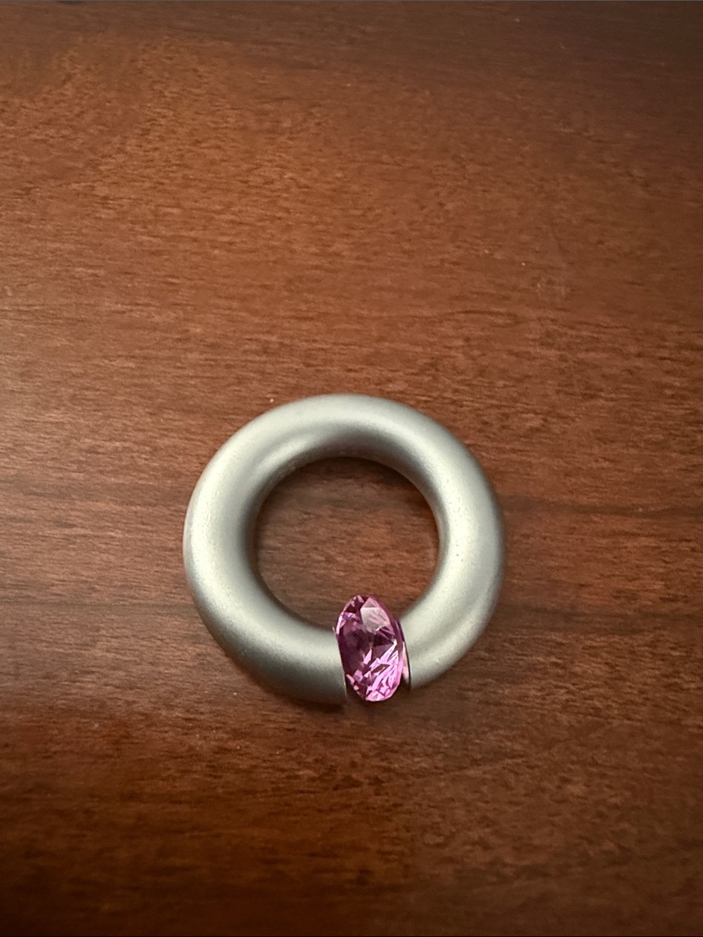Niessing Steel Pink Lab Sapphire Rolling Ring